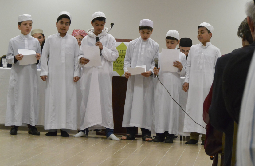 Children from the British Afghan community singing prayers  